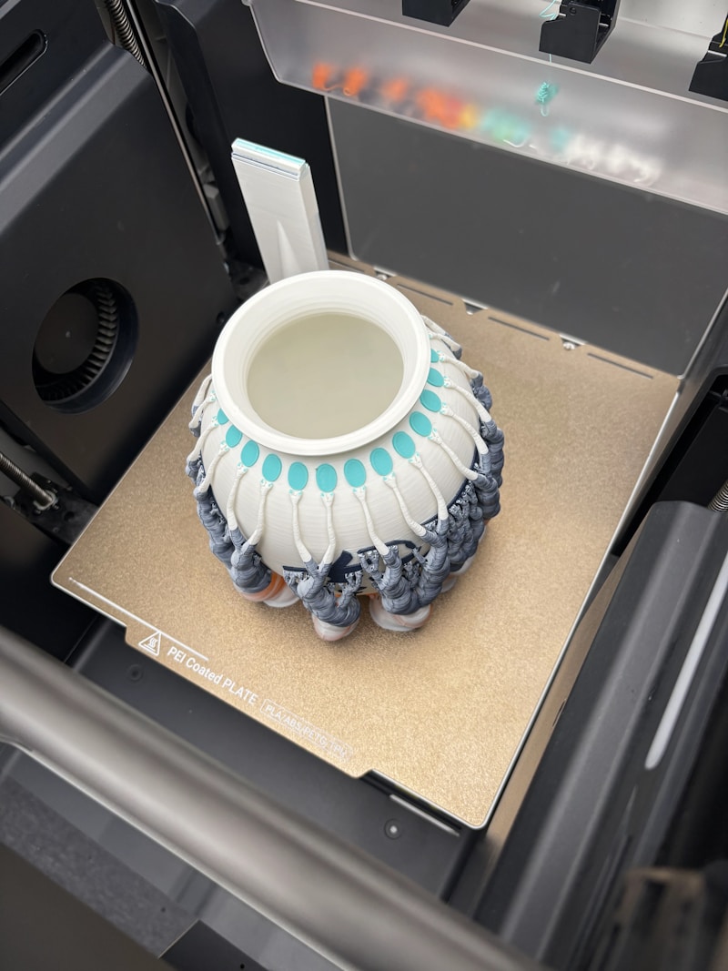 Close-up of 3D printing material and printed objects