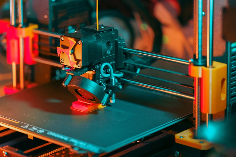 3D printer creating an object with filament visible