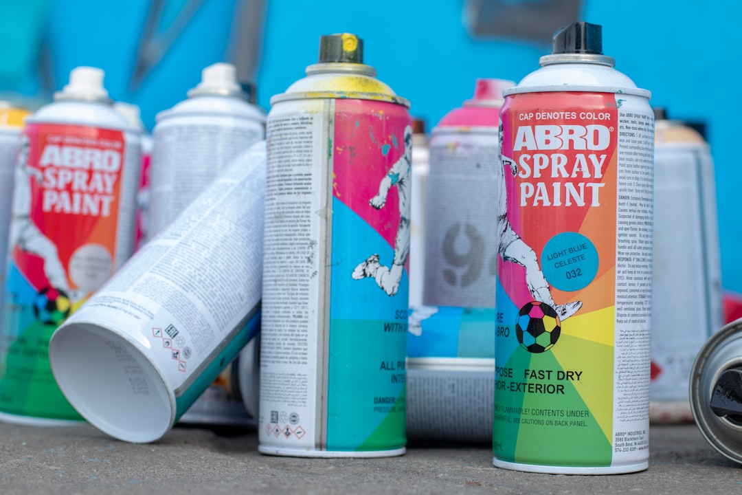 Collection of spray paint cans and primer products for painting 3D printed objects